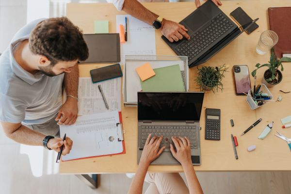 Several people working on the same table